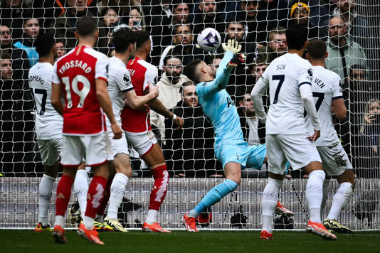 Tottenham 2-3 Arsenal: Gunners survive second-half scare to cement their place at top with north London derby win.